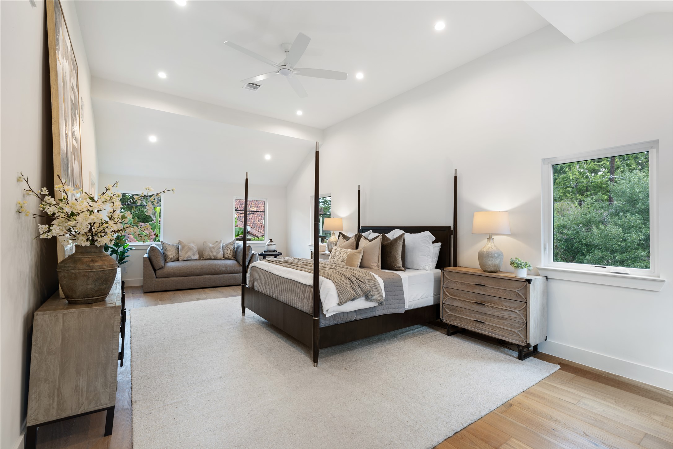 814 Azalea Street Houston, TX 77018 - Photo 12 of 31 Spacious primary suite with high ceiling, seating area, and abundant natural light