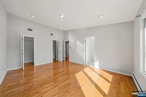a bathroom with a toilet sink shower and mirror