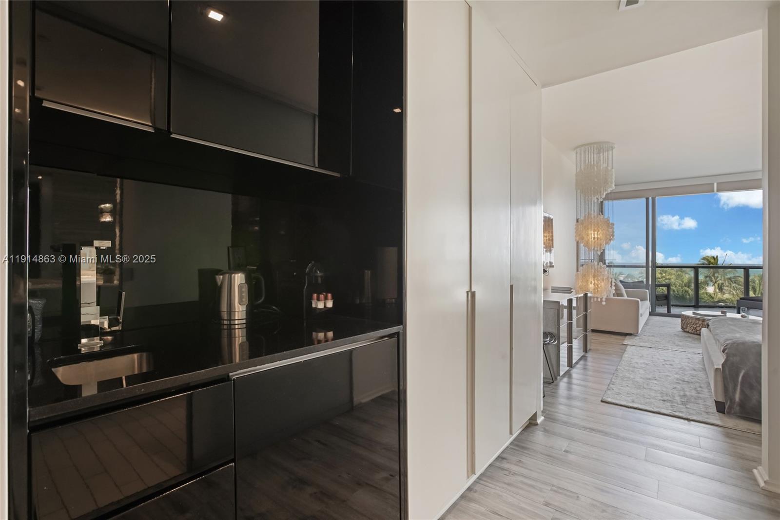 2201 Collins Avenue, Unit 523 Miami Beach, FL 33139 - Photo 14 of 18 a view of a lobby with black carpet