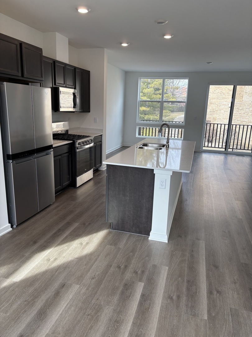 369 Summit Circle Lombard, IL 60148 - Photo 4 of 11 a kitchen with stainless steel appliances a refrigerator and a stove