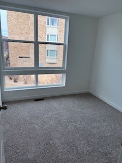 369 Summit Circle Lombard, IL 60148 - Photo 9 of 11 an empty room with a window