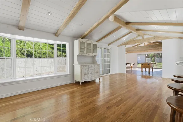 a view of kitchen with furniture and wooden floor