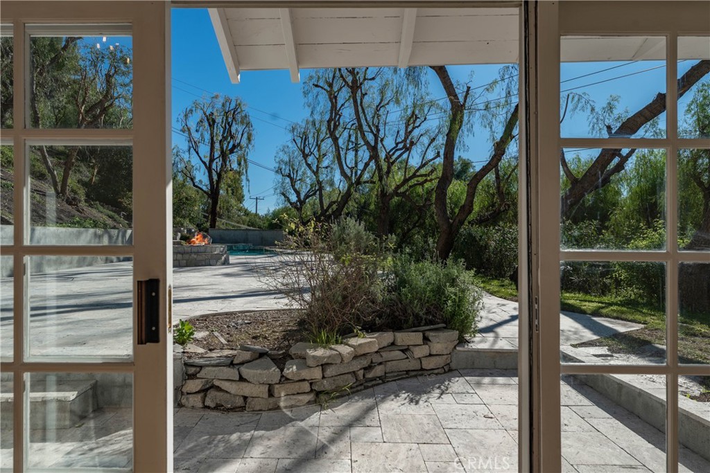5550 Penland Road Hidden Hills, CA 91302 - Photo 48 of 55 Pool House View to Yard (VIRTUALLY ENHANCED FIRE in Pit)