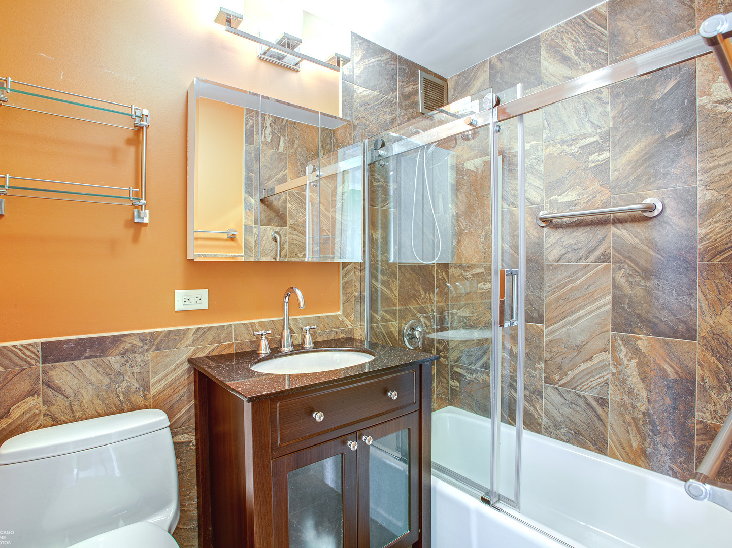 1700 East 56th Street, Unit 2907 Chicago, IL 60637 - Photo 15 of 17 a bathroom with a sink and a mirror