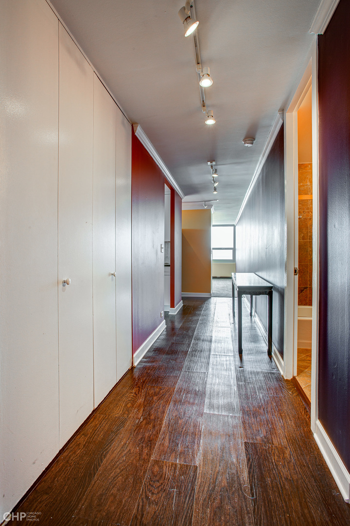 1700 East 56th Street, Unit 2907 Chicago, IL 60637 - Photo 16 of 17 a view of a hallway with wooden floor