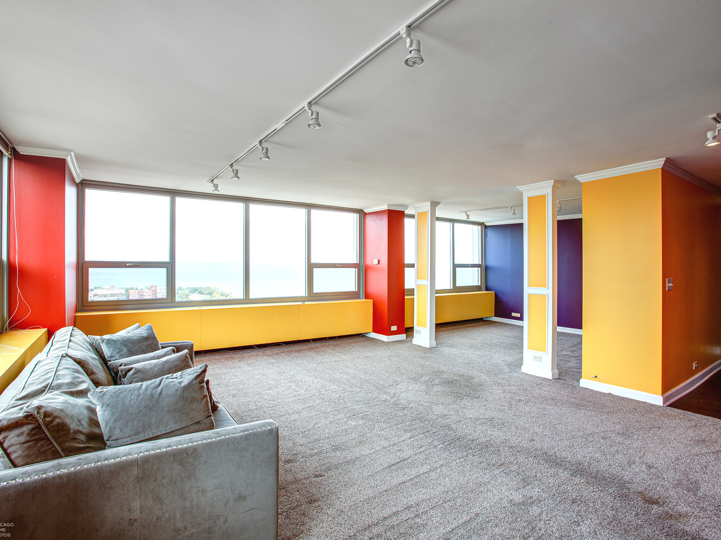 1700 East 56th Street, Unit 2907 Chicago, IL 60637 - Photo 5 of 17 a living room with furniture and a flat screen tv