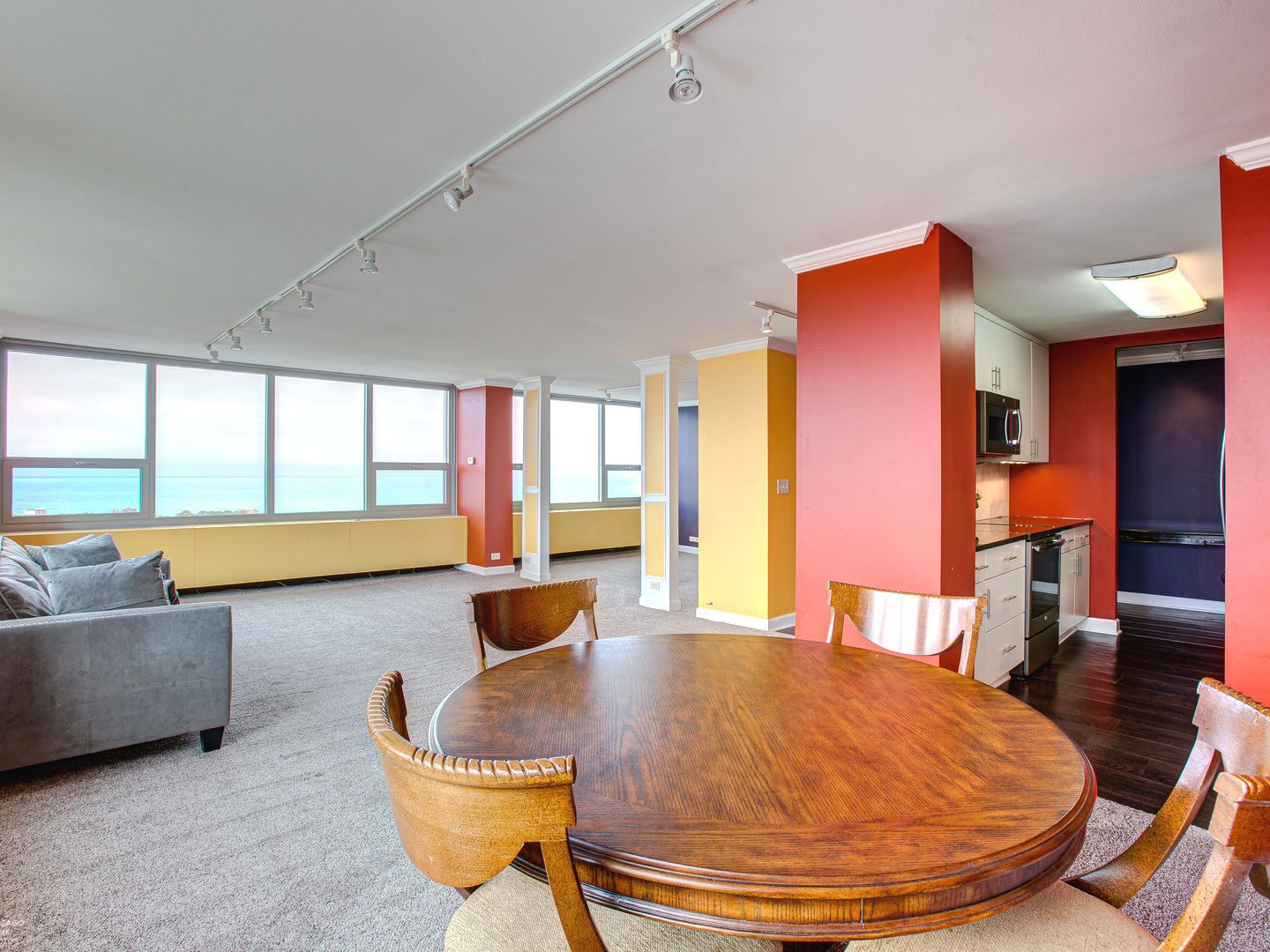 1700 East 56th Street, Unit 2907 Chicago, IL 60637 - Photo 7 of 17 a living room with furniture and a large window
