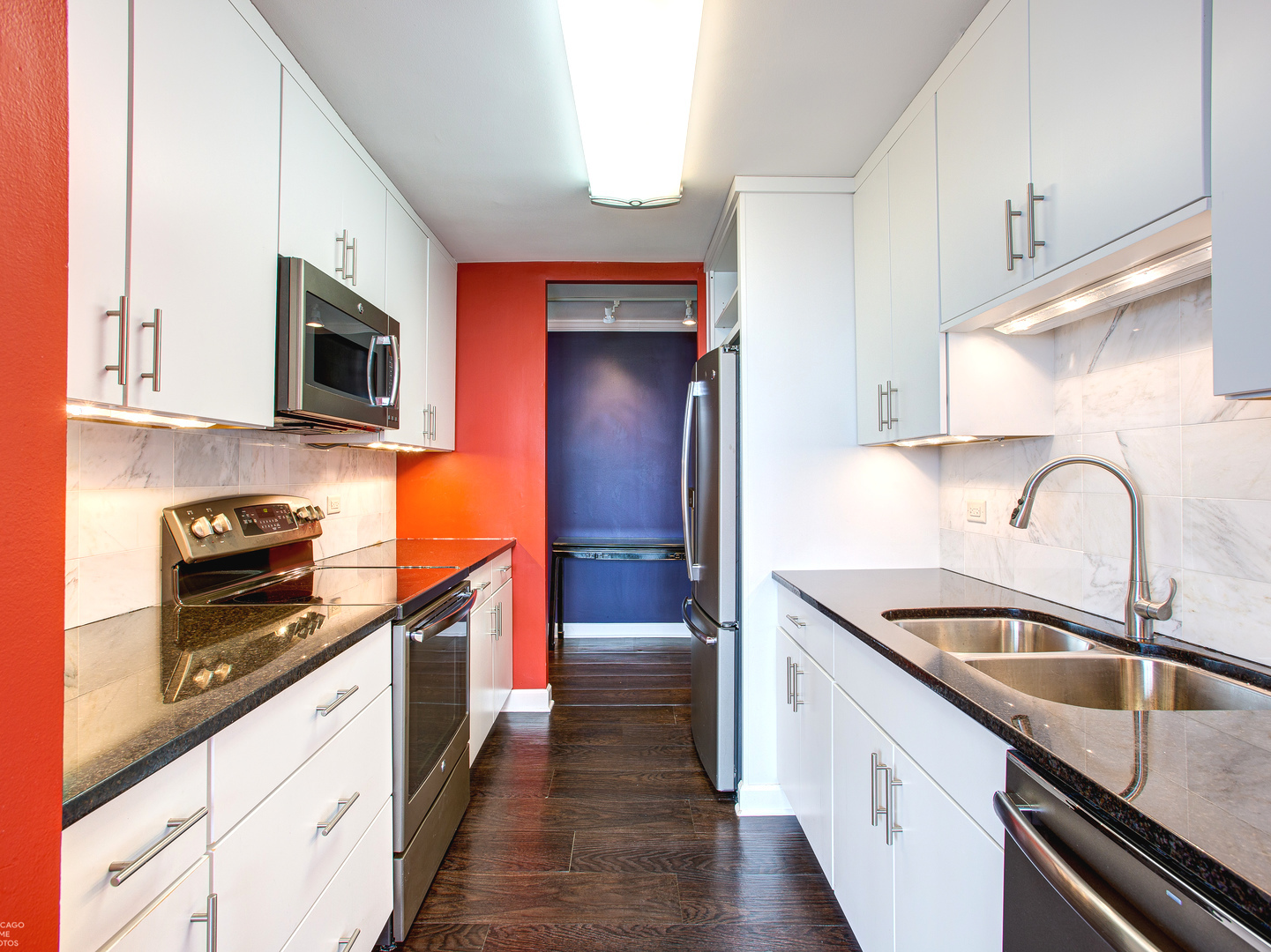 1700 East 56th Street, Unit 2907 Chicago, IL 60637 - Photo 8 of 17 a kitchen with stainless steel appliances granite countertop a sink a stove and cabinets
