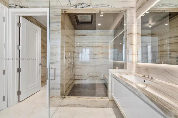 a bathroom with a bathtub and shower