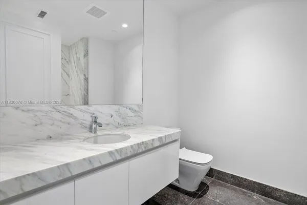 a bathroom with bathtub and shower