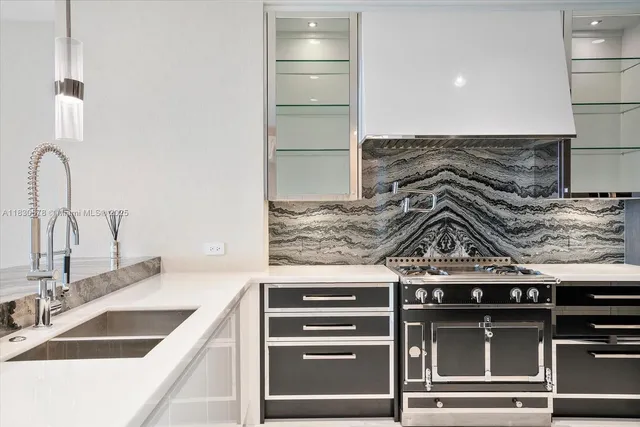 a kitchen with a stove and a sink