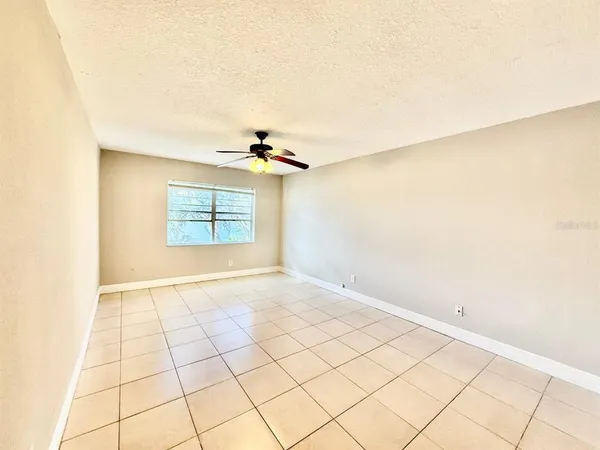 a view of an empty room and a window