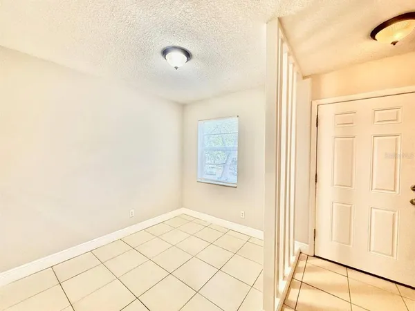 a view of a room with wooden floor and cabinet