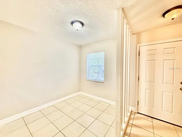 a view of a room with wooden floor and cabinet