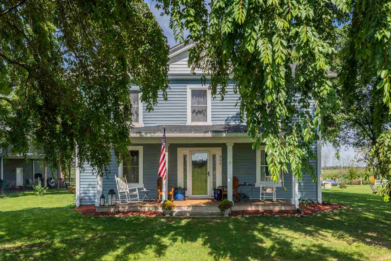 352 Battlefield Road Waynesboro, VA 22980 - Photo 1 of 46 a front view of a house with a garden and tree