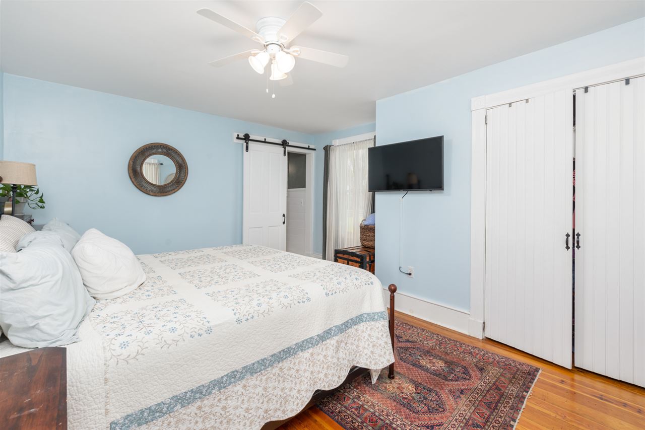 352 Battlefield Road Waynesboro, VA 22980 - Photo 21 of 46 a bedroom with a bed and a flat screen tv