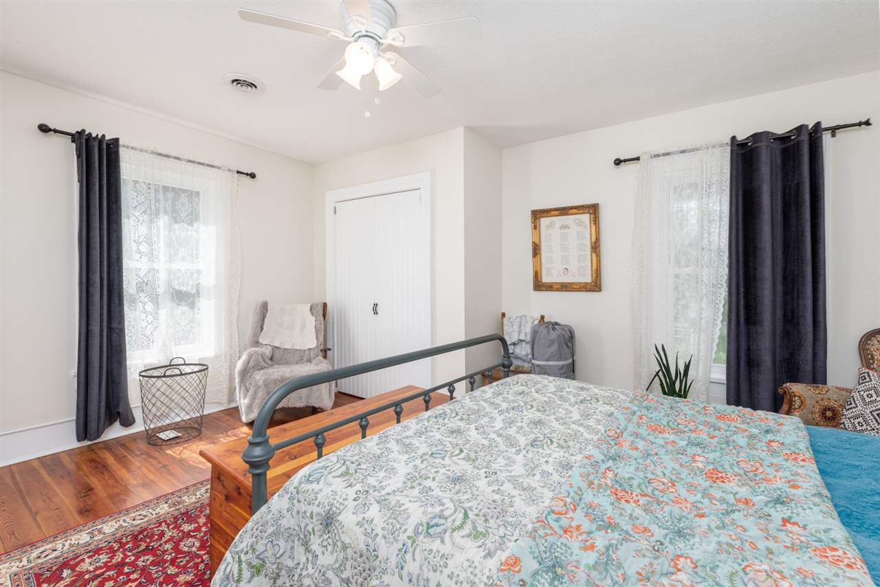 352 Battlefield Road Waynesboro, VA 22980 - Photo 30 of 46 a bedroom with a large bed and a flat tv screen