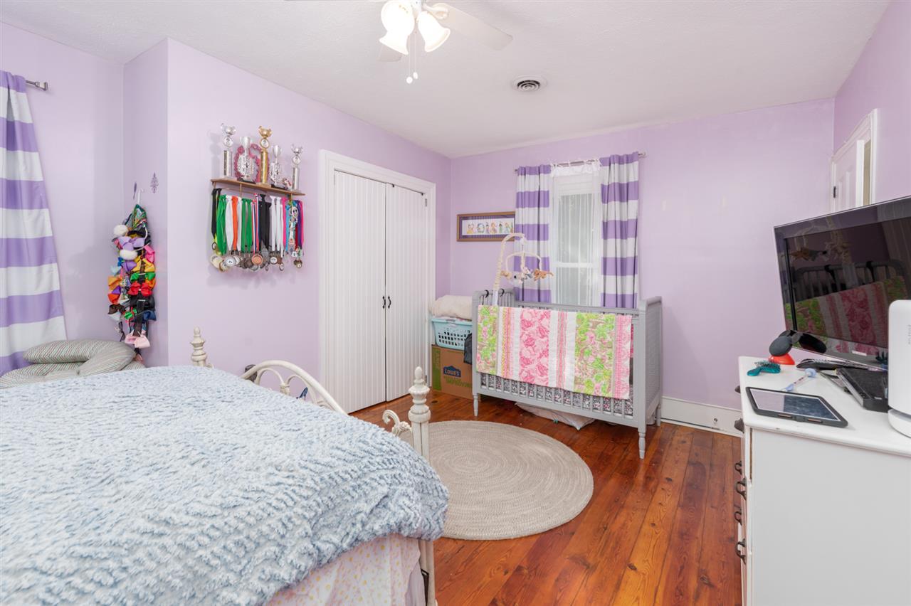 352 Battlefield Road Waynesboro, VA 22980 - Photo 32 of 46 a bedroom with a bed and a flat screen tv