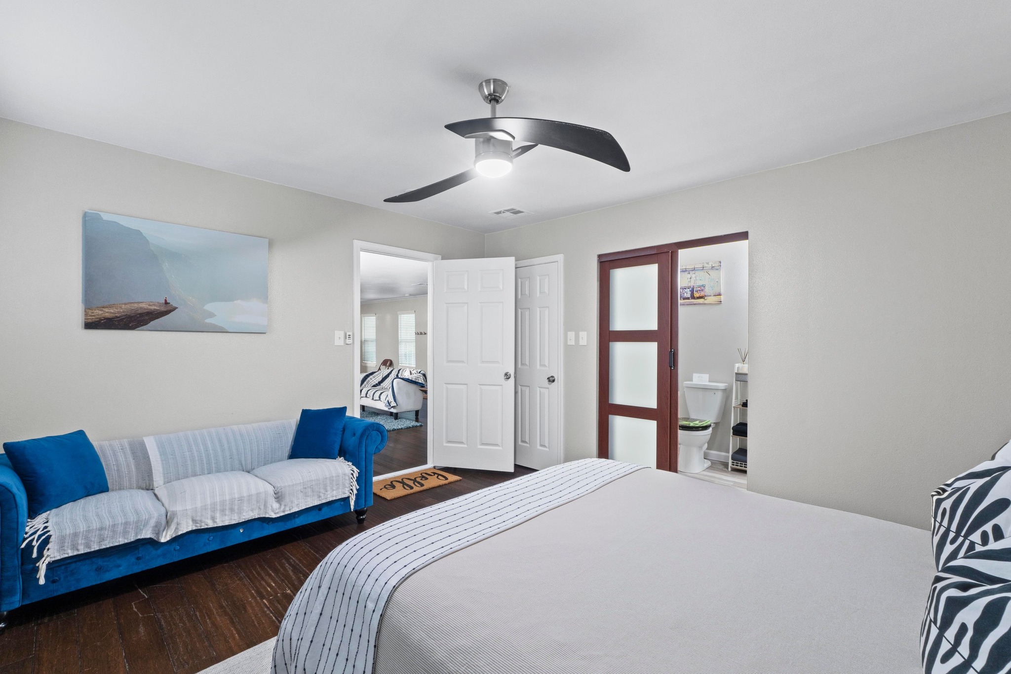 4512 Speedway, Unit A Austin, TX 78751 - Photo 29 of 39 a spacious bedroom with a bed and a couch
