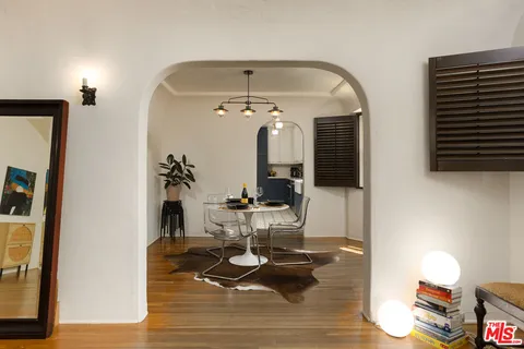 a dining room with furniture and window