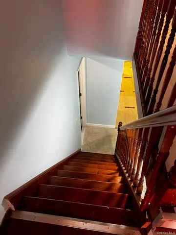 a view of a wooden deck with a chair