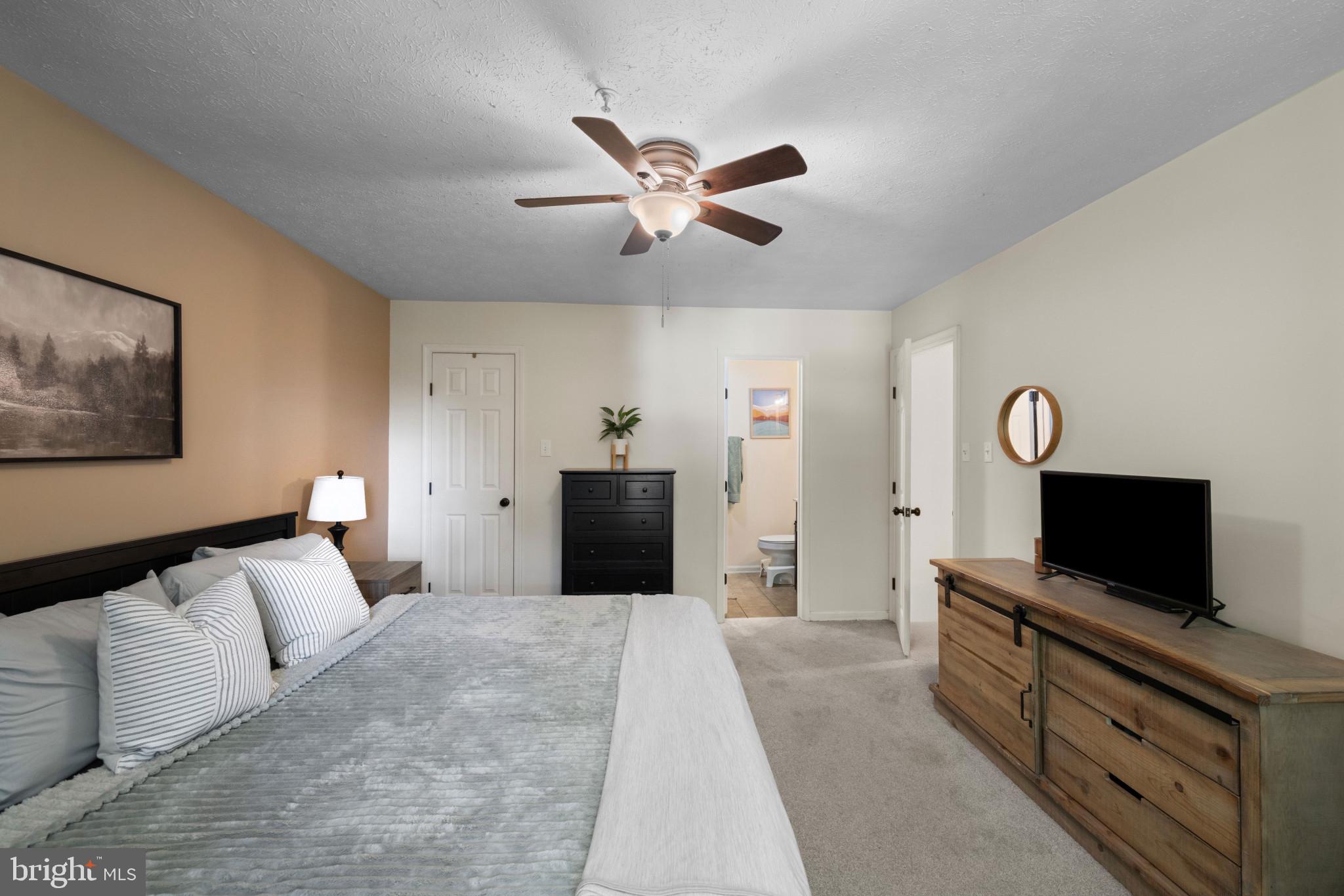 3105 Cardinal Way, Unit L Abingdon, MD 21009 - Photo 14 of 31 a bedroom with a bed and a flat screen tv