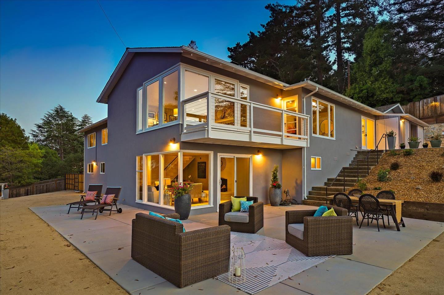 a view of living room with patio furniture and potted plants