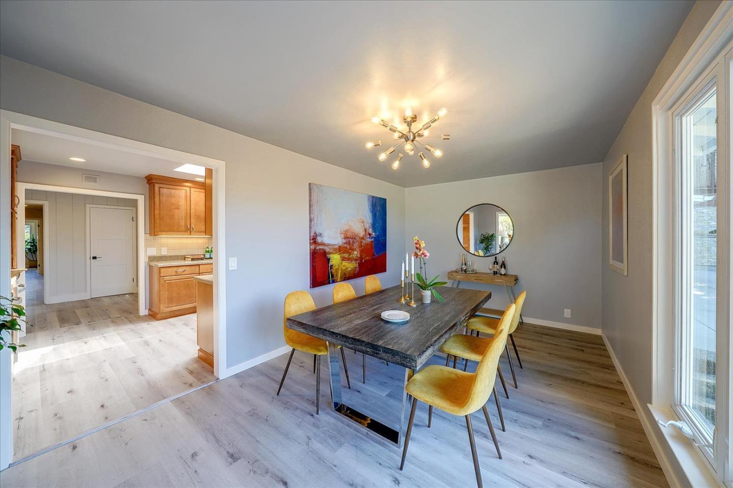 1122 Southdown Road Hillsborough, CA 94010 - Photo 11 of 42 a view of a dining room with furniture and wooden floor