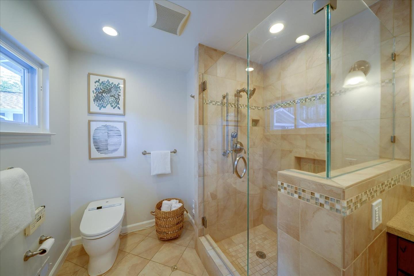 1122 Southdown Road Hillsborough, CA 94010 - Photo 15 of 42 a bathroom with a toilet sink and shower