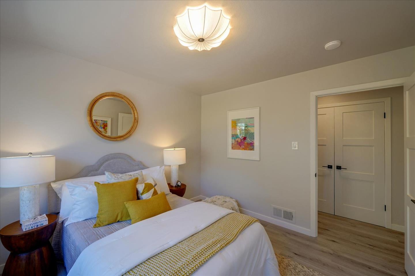 1122 Southdown Road Hillsborough, CA 94010 - Photo 19 of 42 a bedroom with a bed and a chandelier