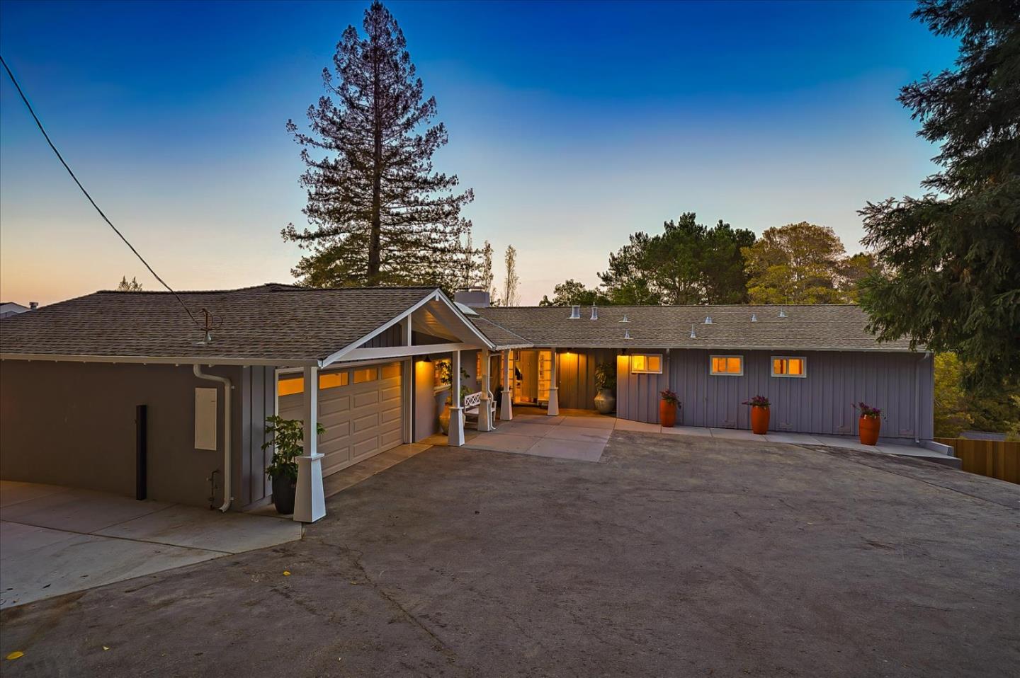 1122 Southdown Road Hillsborough, CA 94010 - Photo 41 of 42 a front view of a house with a yard and garage