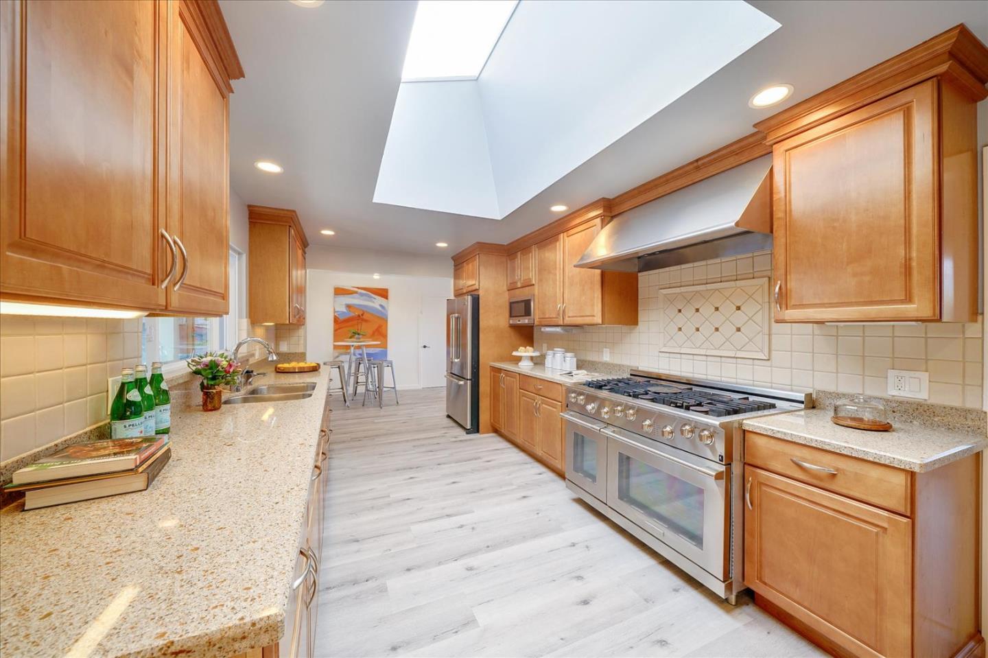 1122 Southdown Road Hillsborough, CA 94010 - Photo 6 of 42 a kitchen with stainless steel appliances granite countertop a stove a sink dishwasher and a refrigerator
