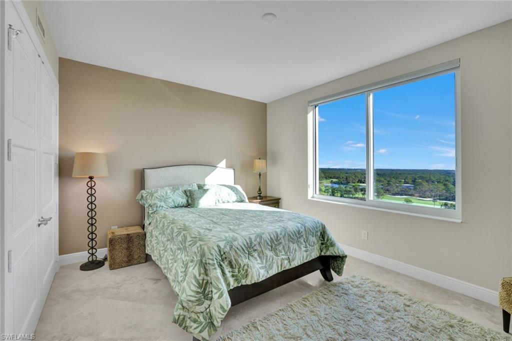265 Indies Way, Unit 904 Naples, FL 34110 - Photo 15 of 19 a bed sitting in a bedroom next to a window
