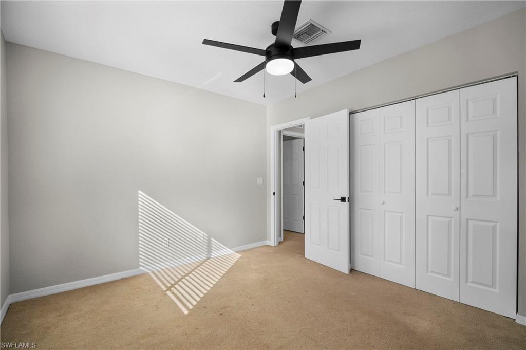 9648 Roundstone Circle Fort Myers, FL 33967 - Photo 15 of 30 a view of a room with a ceiling fan