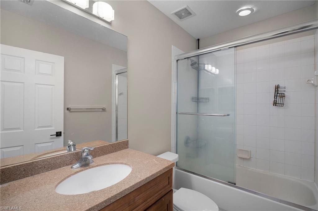 9648 Roundstone Circle Fort Myers, FL 33967 - Photo 19 of 30 a bathroom with a sink toilet and shower