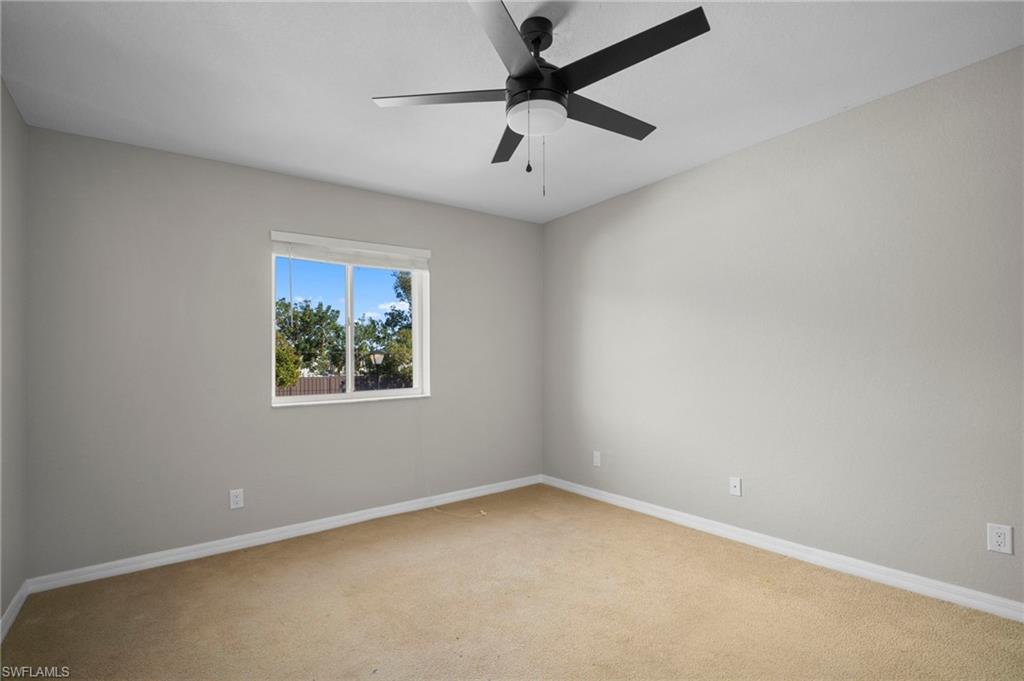 9648 Roundstone Circle Fort Myers, FL 33967 - Photo 24 of 30 an empty room with a window and a fan