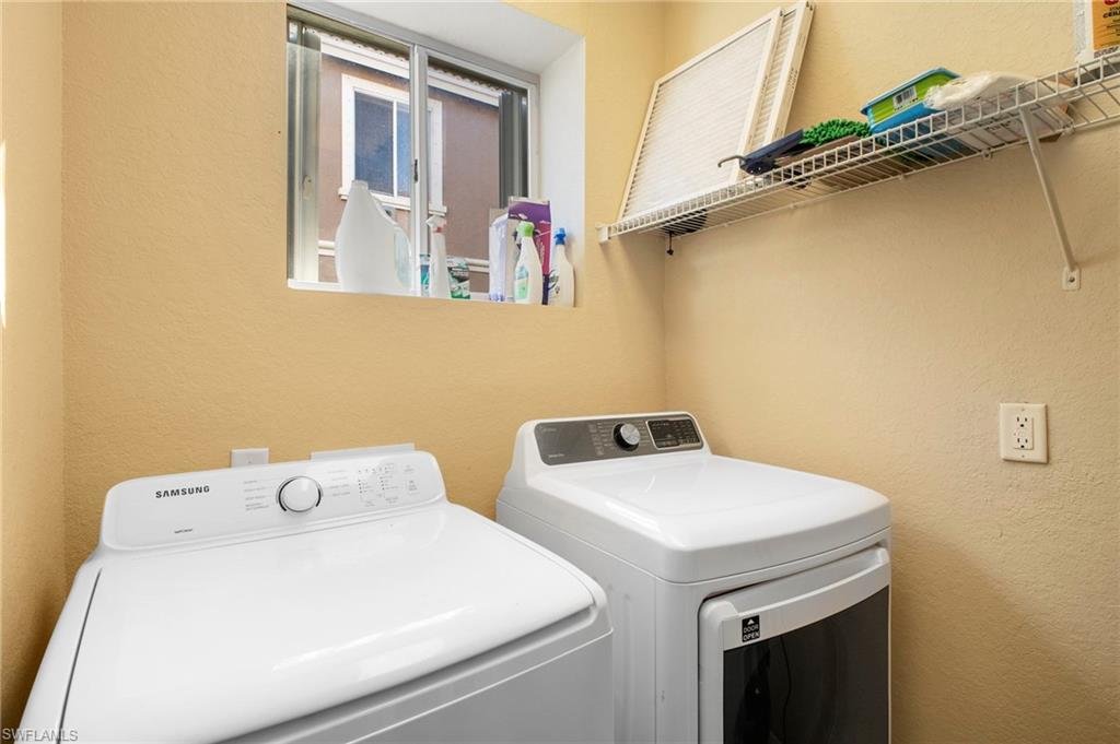 9648 Roundstone Circle Fort Myers, FL 33967 - Photo 26 of 30 a utility room with dryer and washer