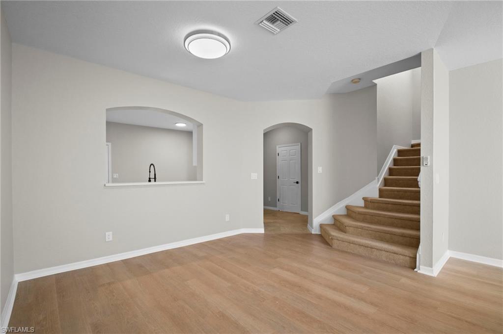 9648 Roundstone Circle Fort Myers, FL 33967 - Photo 4 of 30 a view of an entryway with wooden floor