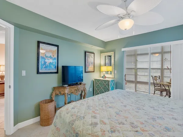 a bedroom with furniture and a window