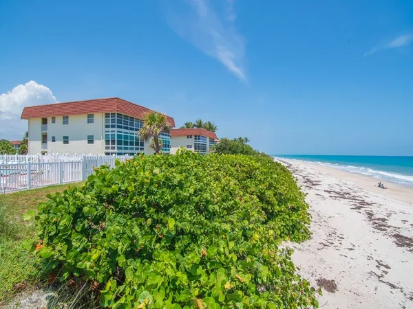 a view of a large building with a big yard