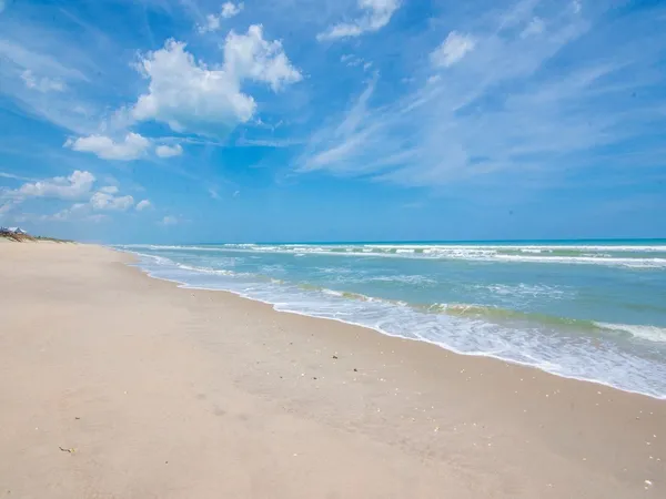 a view of beach and ocean