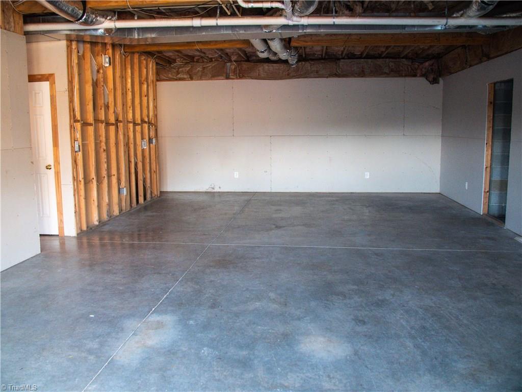1865 Handy Road Denton, NC 27239 - Photo 25 of 29 Unfinished Basement Playroom