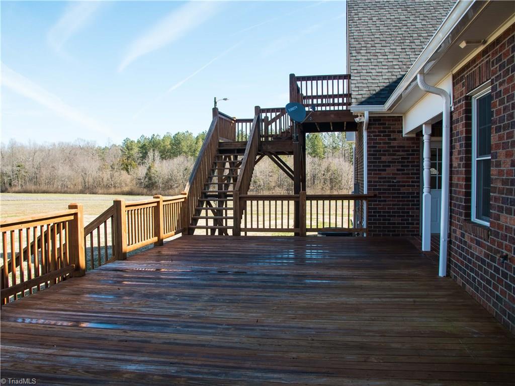 1865 Handy Road Denton, NC 27239 - Photo 28 of 29 Rear deck with stairs to bonus room over garage