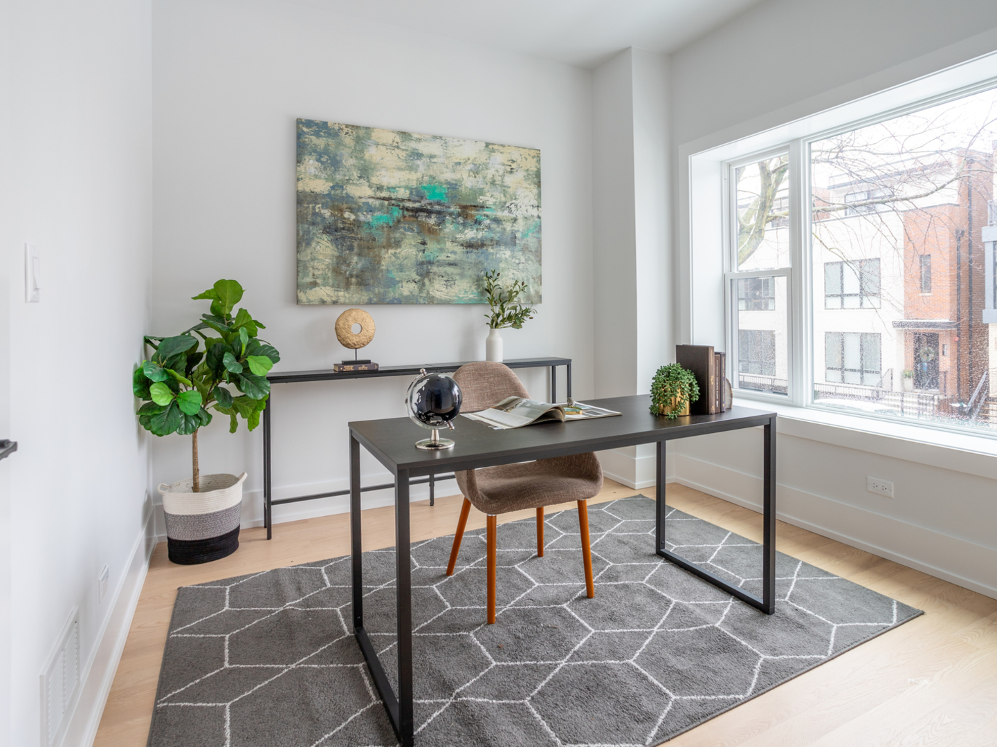 2228 West Lyndale Street Chicago, IL 60647 - Photo 18 of 23 a workspace with furniture and a potted plant