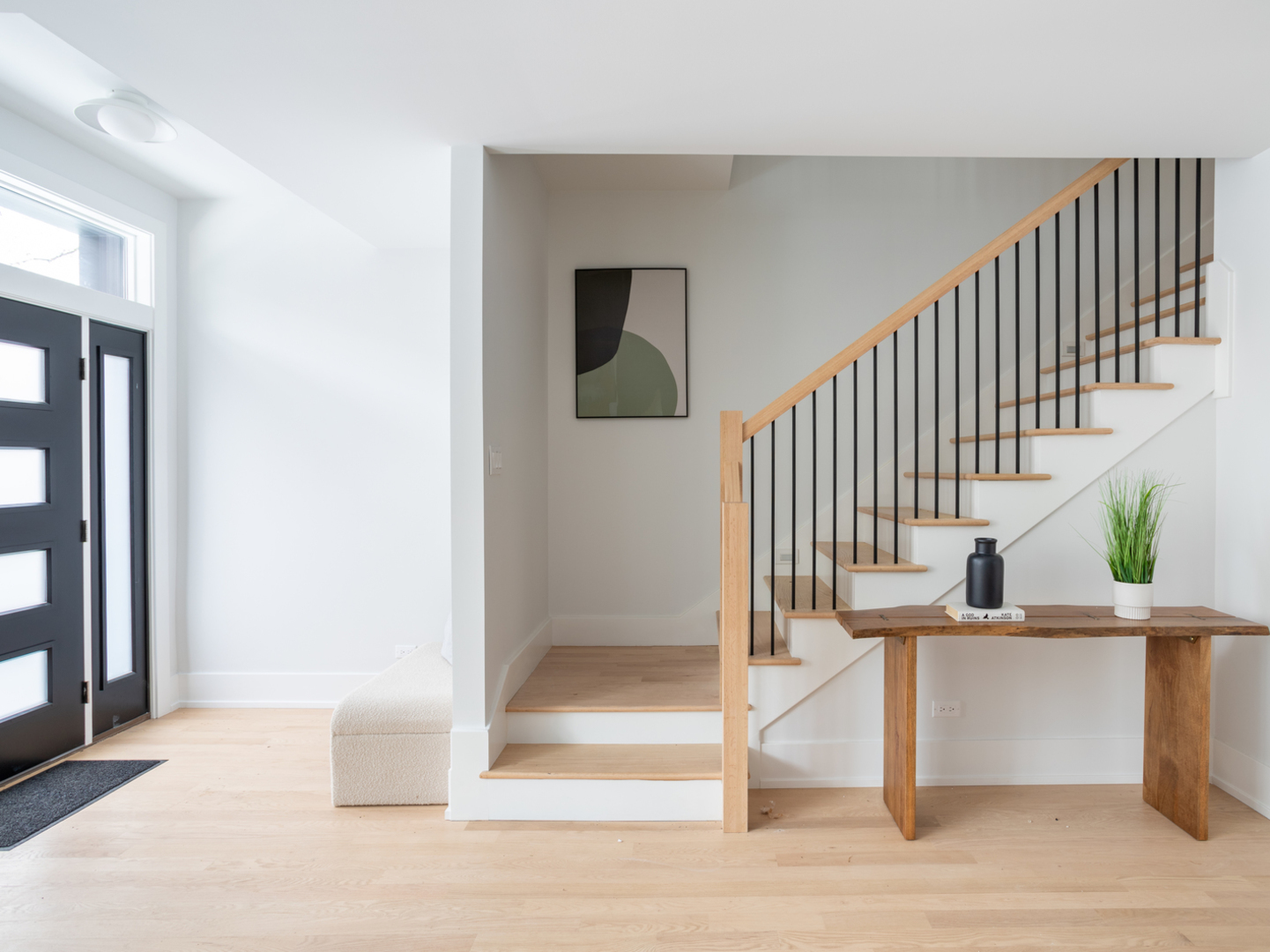 2228 West Lyndale Street Chicago, IL 60647 - Photo 4 of 23 a view of entryway and hall with wooden floor