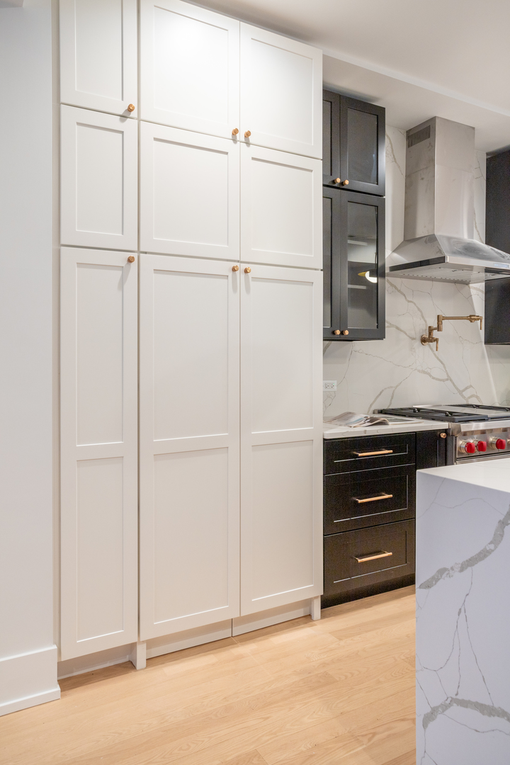 2228 West Lyndale Street Chicago, IL 60647 - Photo 7 of 23 a kitchen with a refrigerator and cabinets