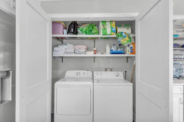 a view of storage and utility room with washer and dryer