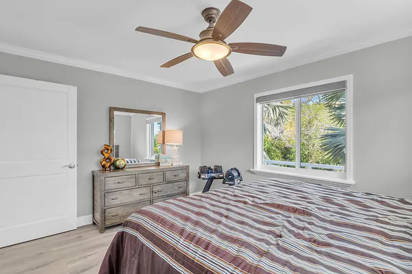 a bed room with a bed and a window