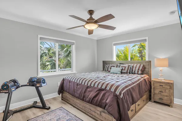 a bedroom with a bed and window