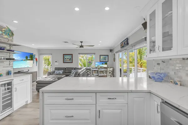 a kitchen with stainless steel appliances granite countertop a sink and cabinets